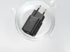 A black USB-C charger with a 20W rating is shown inside a clear bubble against a light gray and white background. Produktbild-Vorschau