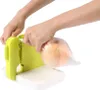 Hands using a mini bag sealer to seal a bag containing a peach. Náhled obrázku produktu