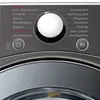A close-up view of a washing machine control panel with various program selections and buttons. Produktbild-Vorschau