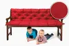 Two young boys are lying under a red cushioned bench. Produktbild-Vorschau