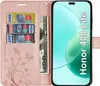 A pink flip wallet case for a smartphone, with credit cards and a banknote inserted. Produktbild-Vorschau