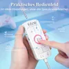 A hand holding a white audio control device with various buttons and a digital display, with a gaming controller blurred in the background. Produktbild-Vorschau