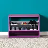 A shoe rack filled with shoes against a teal wall. Voir les images du produit