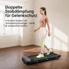 A woman is walking on a treadmill in a room. Produktbild-Vorschau