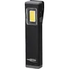 A black flashlight with a gray top and bottom, and a bright yellow light source. The flashlight has a clip on the side and the brand name is visible. Náhled obrázku produktu