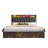 A bed with a headboard featuring LED lighting and a shelf. Voir les images du produit