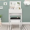 A white vanity table with a mirror and a black stool in front of it, set against a green wall. Náhľad obrázku produktu