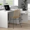 A modern white desk with a laptop, lamp, and chair in a home office setting. Náhľad obrázku produktu