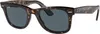 A pair of tortoise shell sunglasses with gray lenses. Anteprima dell’immagine prodotto
