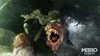 A monstrous creature with sharp teeth and claws lunges forward, its mouth wide open in a terrifying roar. The background is dark and murky, with hints of debris and a watery or foggy atmosphere. The Metro Exodus logo is visible in the bottom right corner. Produktbild-Vorschau