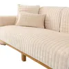 Close-up view of a beige sofa cover with textured pattern. Náhled obrázku produktu