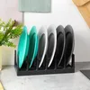 A dish rack holding several plates on a kitchen counter. Náhled obrázku produktu