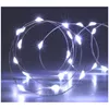 A coiled string of white LED lights on a reflective surface. Produktbild-Vorschau