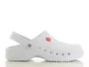 A white clog shoe is shown from the side against a white background. Produktbild-Vorschau