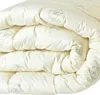 A folded winter duvet with a sheep pattern. Produktbild-Vorschau