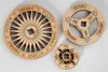 Three wooden discs with intricate designs and text, likely components of a larger model or puzzle. Náhľad obrázku produktu