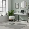 A modern home office setup with a desk, laptop, and a white stool. Anteprima dell’immagine prodotto