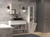 A modern bathroom vanity with a black sink, mirror, and storage shelves, next to a tall white storage cabinet with a laundry basket. Náhled obrázku produktu