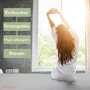 A woman stretching in bed by a window, with feature callouts on the left. Produktbild-Vorschau