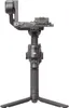 A black camera gimbal stabilizer with a tripod base, shown against a white background. Náhled obrázku produktu