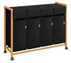 A four-compartment laundry sorter with a bamboo frame and black fabric bins, shown on a white background. Anteprima dell’immagine prodotto