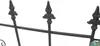 A close-up view of a metal fence with decorative finials. Náhľad obrázku produktu