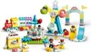 A collection of LEGO DUPLO amusement park toys, including a train, carousel, Ferris wheel, and slides, with several minifigures. Podgląd zdjęcia produktu