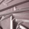 A close-up view of draped pink fabric. Podgląd zdjęcia produktu