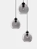 Three pendant lights with gray glass globes and black fixtures are shown against a white background. Anteprima dell’immagine prodotto