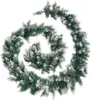 A green Christmas garland with pinecones and artificial snow, coiled in a spiral. Produktbild-Vorschau