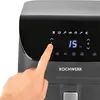 A close-up of a digital air fryer's control panel with a finger pressing a button. Produktbild-Vorschau