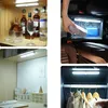 A collage of four images showing LED strip lights used in different settings: a cabinet with bottles, a car interior, a shelf with books and desk items, and a wardrobe with clothes. Produktbild-Vorschau