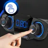 A close-up shot of a car FM transmitter with a finger pressing a button. Anteprima dell’immagine prodotto
