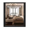 A bedroom scene viewed through a closet door. Produktbild-Vorschau