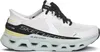 A side view of a white Skechers sneaker with black and light blue accents. Voir les images du produit