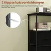 Close-up view of a wall with a wall anchor and screw being inserted, next to a black storage unit with drawers. Anteprima dell’immagine prodotto
