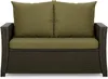 A front view of a brown rattan sofa with green cushions. Produktbild-Vorschau
