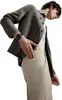 A person wearing a jacket and pants, with a smartwatch on their wrist. Podgląd zdjęcia produktu