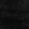 A close-up, textured view of a black rug. Podgląd zdjęcia produktu