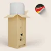 A cardboard box with a rolled-up item inside, and a "Made in Germany" sticker on the side. Produktbild-Vorschau