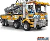 A detailed product shot of a toy concrete pump truck. Podgląd zdjęcia produktu
