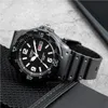 A black Casio watch is placed on a textured black surface, with a hint of a gray surface and a dark object in the background. Voir les images du produit