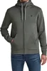 A man wearing a green hooded zip-up jacket and blue jeans. Produktbild-Vorschau