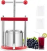 A red and silver fruit press with grapes and a glass of juice next to it. Náhľad obrázku produktu