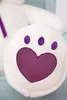 A close-up of a white teddy bear's paw with a purple heart and paw prints. Produktbild-Vorschau