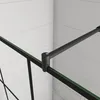 A close-up view of a black shower screen support rod and glass edge, with a white tiled wall in the background. Produktbild-Vorschau
