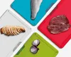 A collage of four colorful cutting boards, each with a different food item on it. Náhľad obrázku produktu