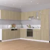 A modern kitchen with light wood cabinets and white countertops. Podgląd zdjęcia produktu