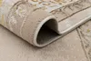 A close-up view of a rolled-up rug, showing its texture and edge binding. Produktbild-Vorschau