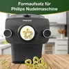 A Philips pasta maker attachment is shown with pasta shapes in the foreground. Produktbild-Vorschau
